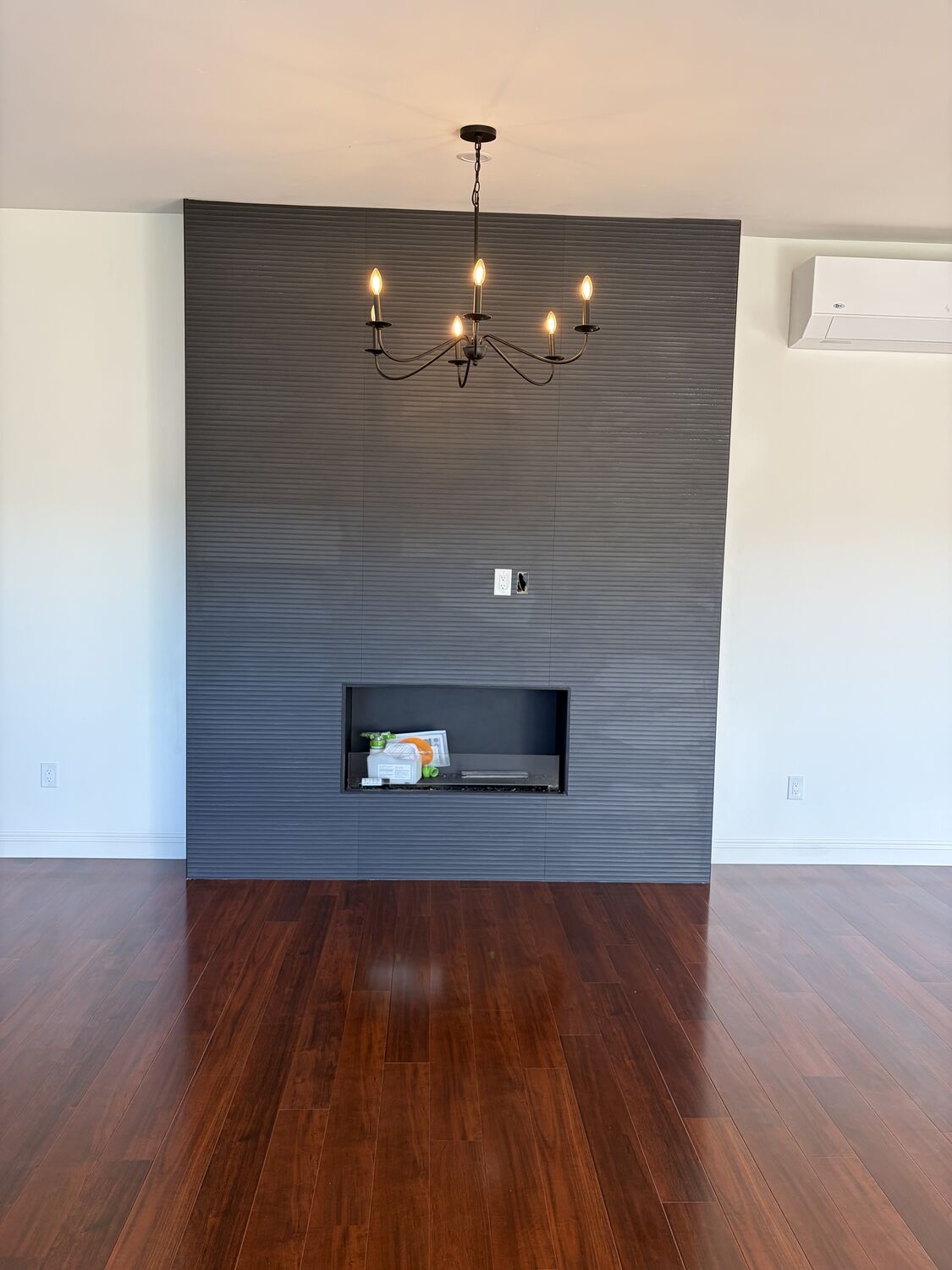 Recessed lighting and a finished feature wall completed by All Current Electric