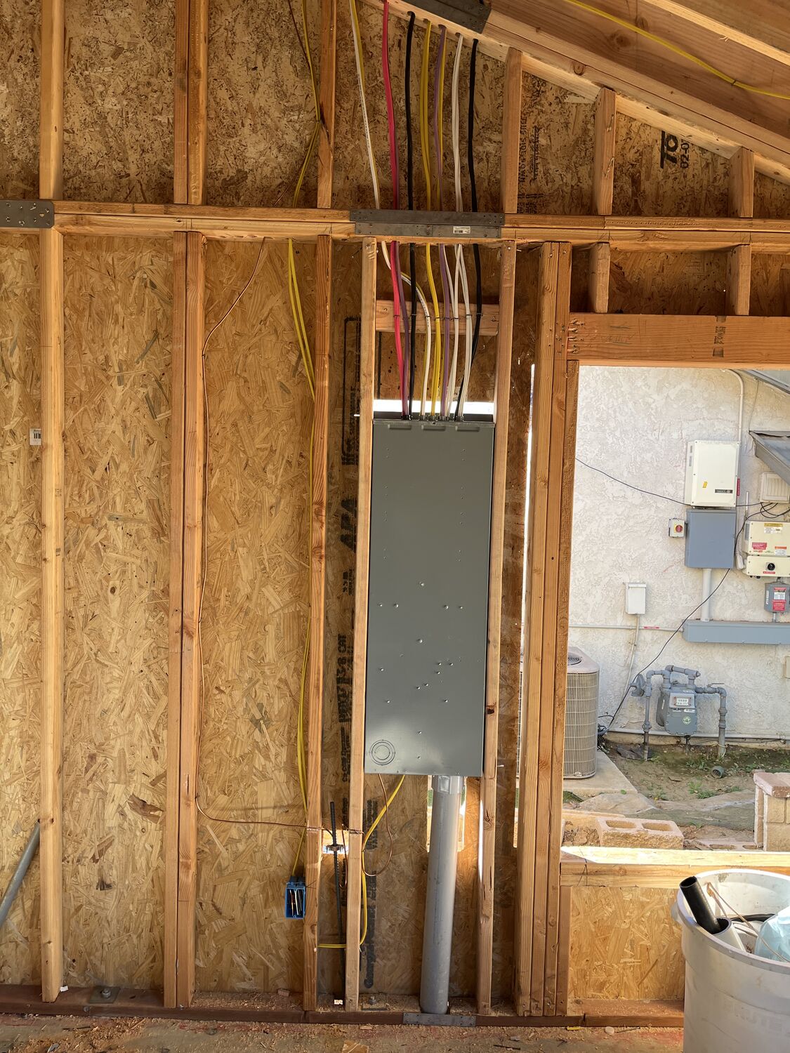 Dedicated circuits and panel roughed in on new framing by All Current Electric
