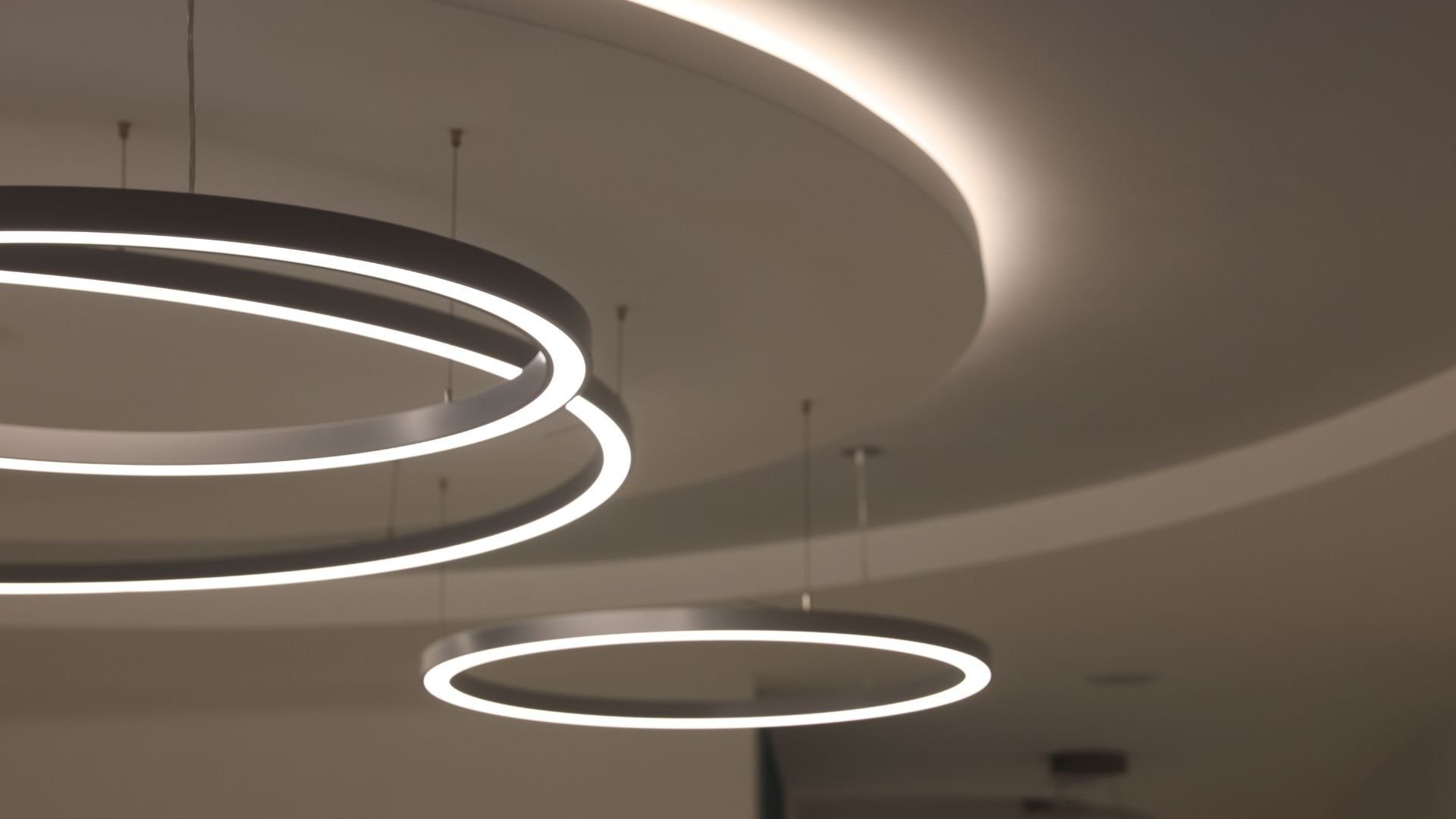 Modern circular hanging light fixtures with soft white illumination